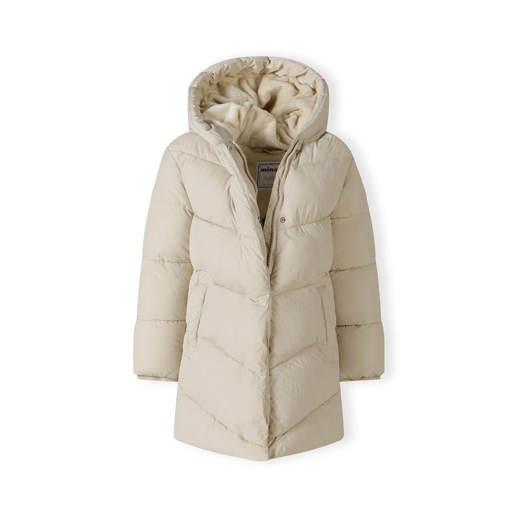Beige long quilted puffer jacket laid flat showing diagonal quilted pattern, hood design and full-length silhouette on white background