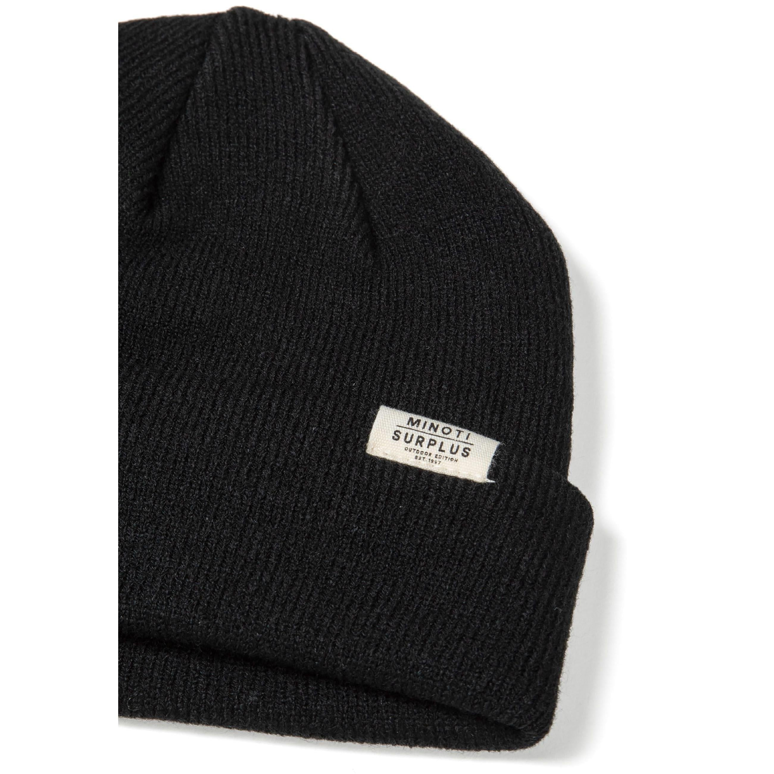 Single grey ribbed beanie hat on white background displaying knitted texture and white Minoti label on turned-up cuff