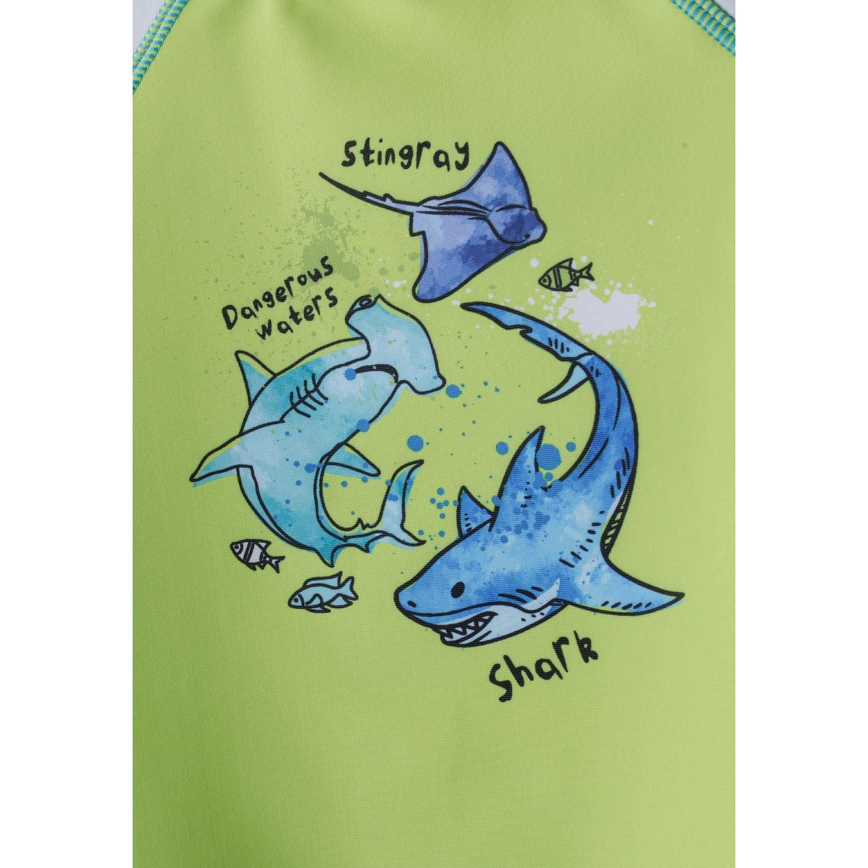 Blue swim shorts with all-over shark and sea creature print including whales and fish on white background