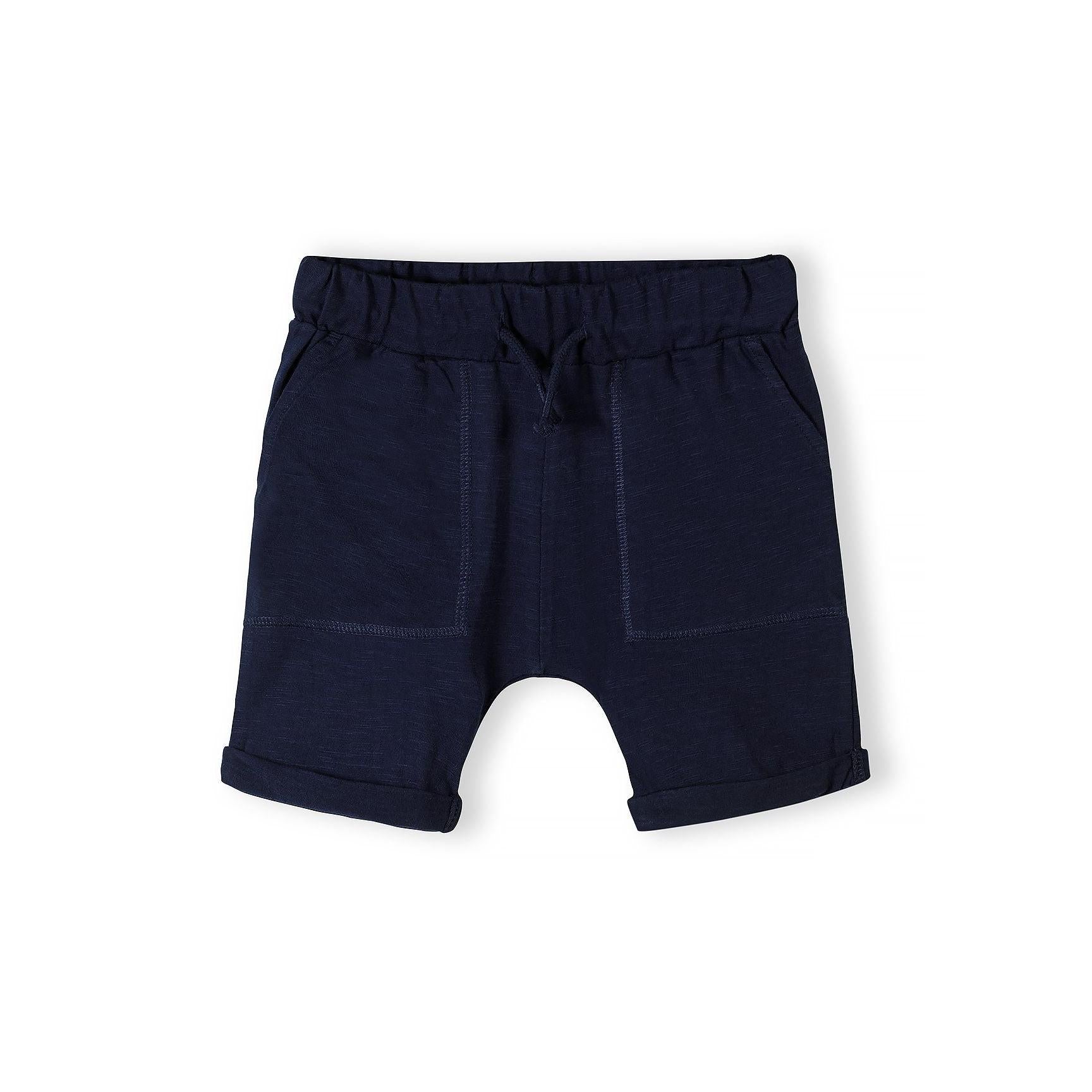 Single black cotton slub jersey shorts with elasticated waistband, drawstring and side pockets with rolled hem on white background