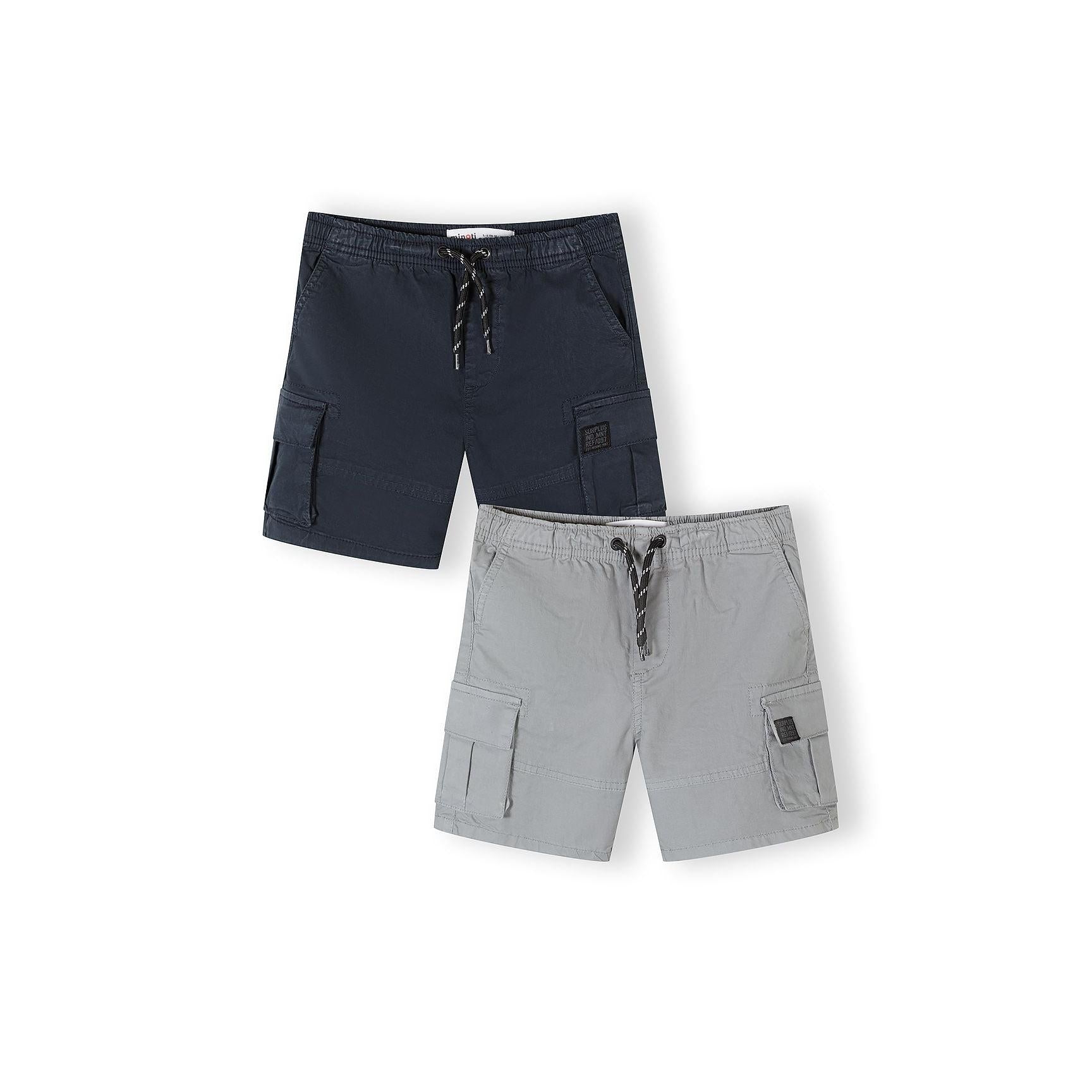 Two cargo shorts laid flat against white background showing grey and navy blue colours with side cargo pockets and elastic waistbands