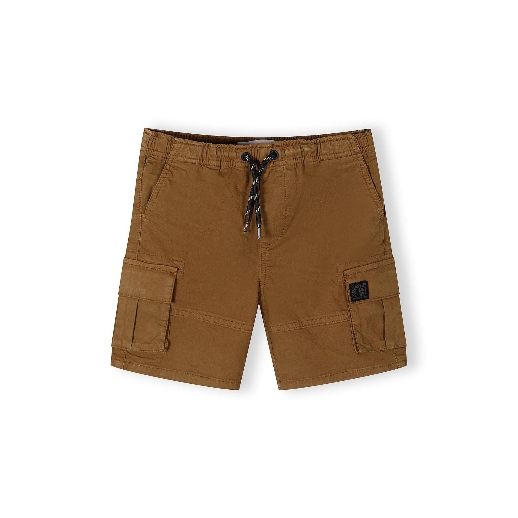 Single pair of camel brown combat shorts laid flat showing front view with cargo pockets, drawstring waist and utility styling on white background