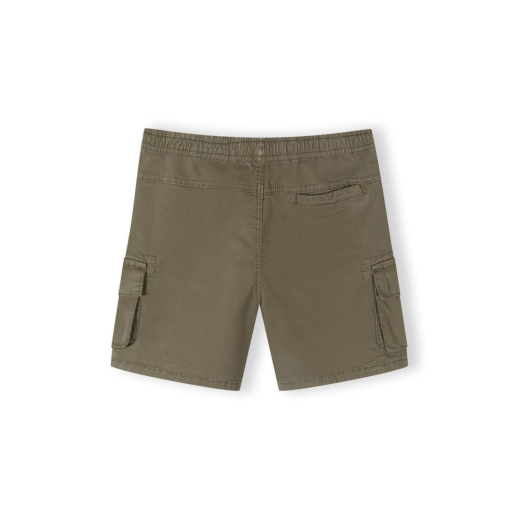 Close-up front view of black Minoti combat shorts on white background showing cargo pockets, drawstring waist and structured fit