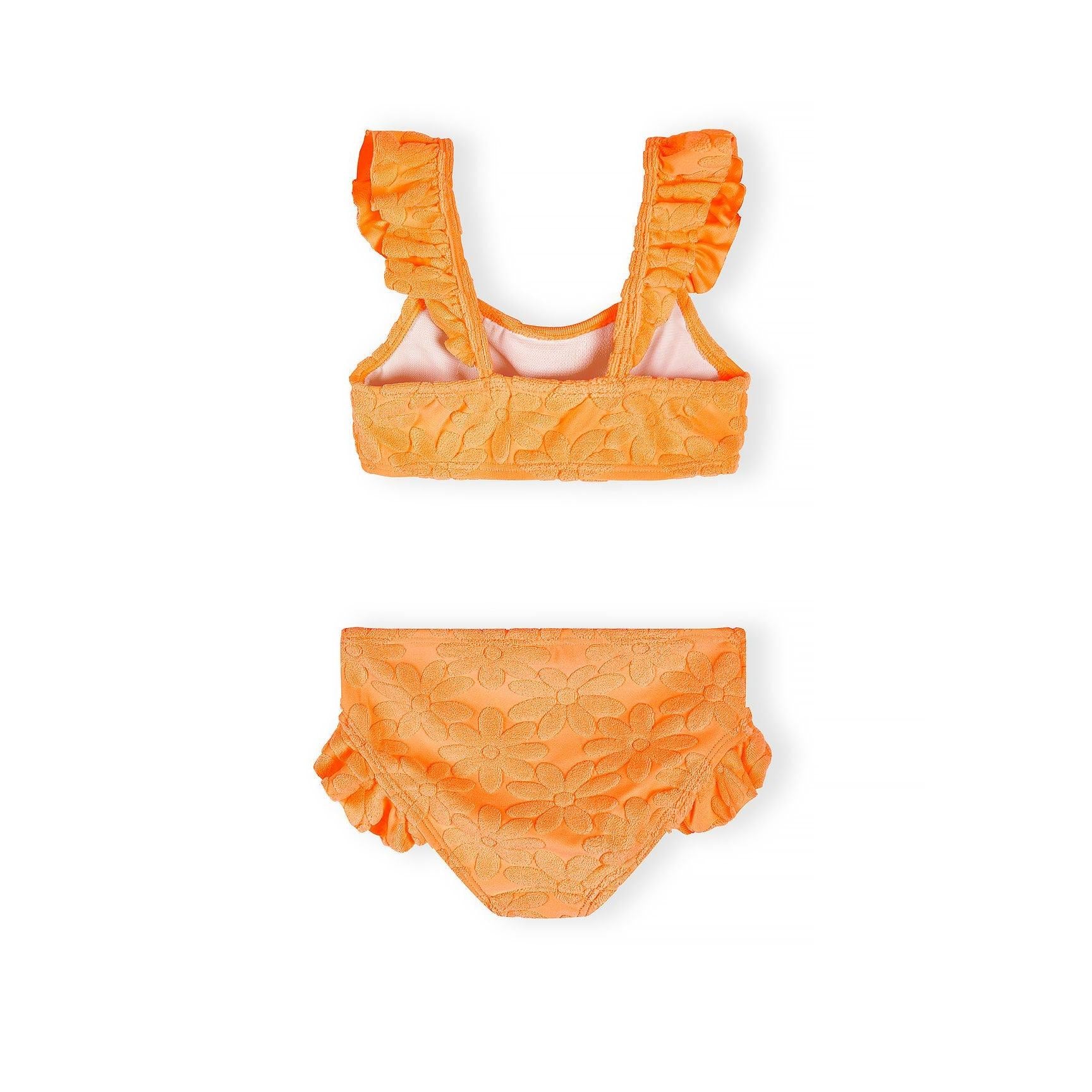 Close-up view of neon orange bikini top with floral jacquard pattern and decorative frill trim on shoulder straps against white background
