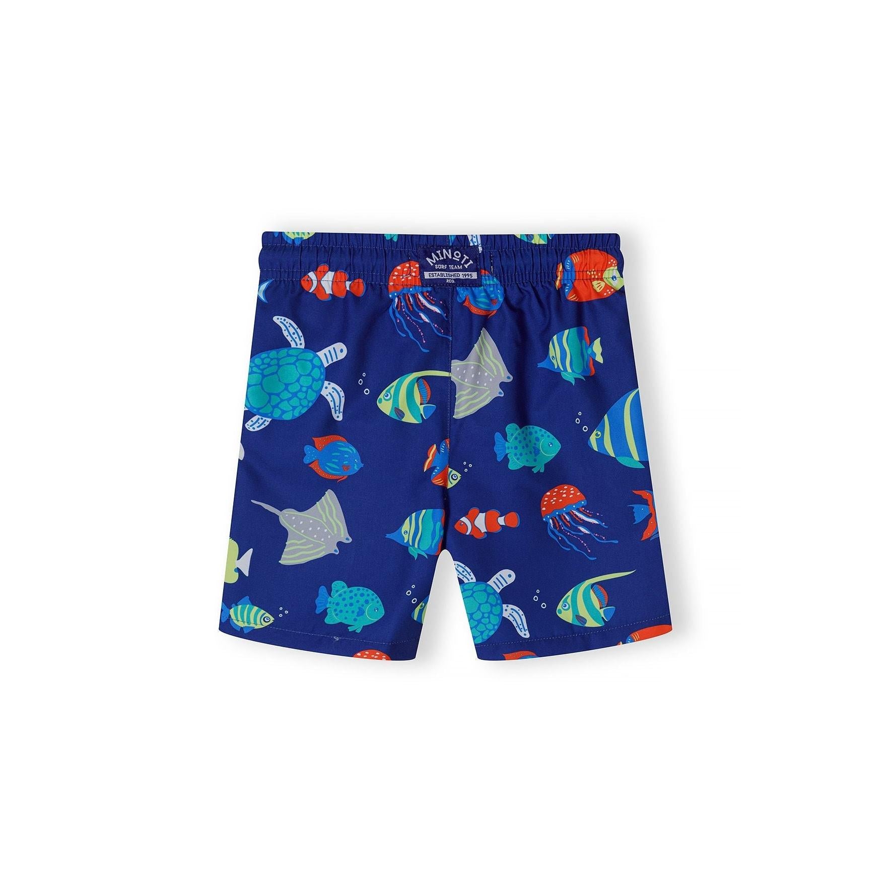 Back view of navy board shorts showing continued sea life print pattern and Minoti brand label at waistband