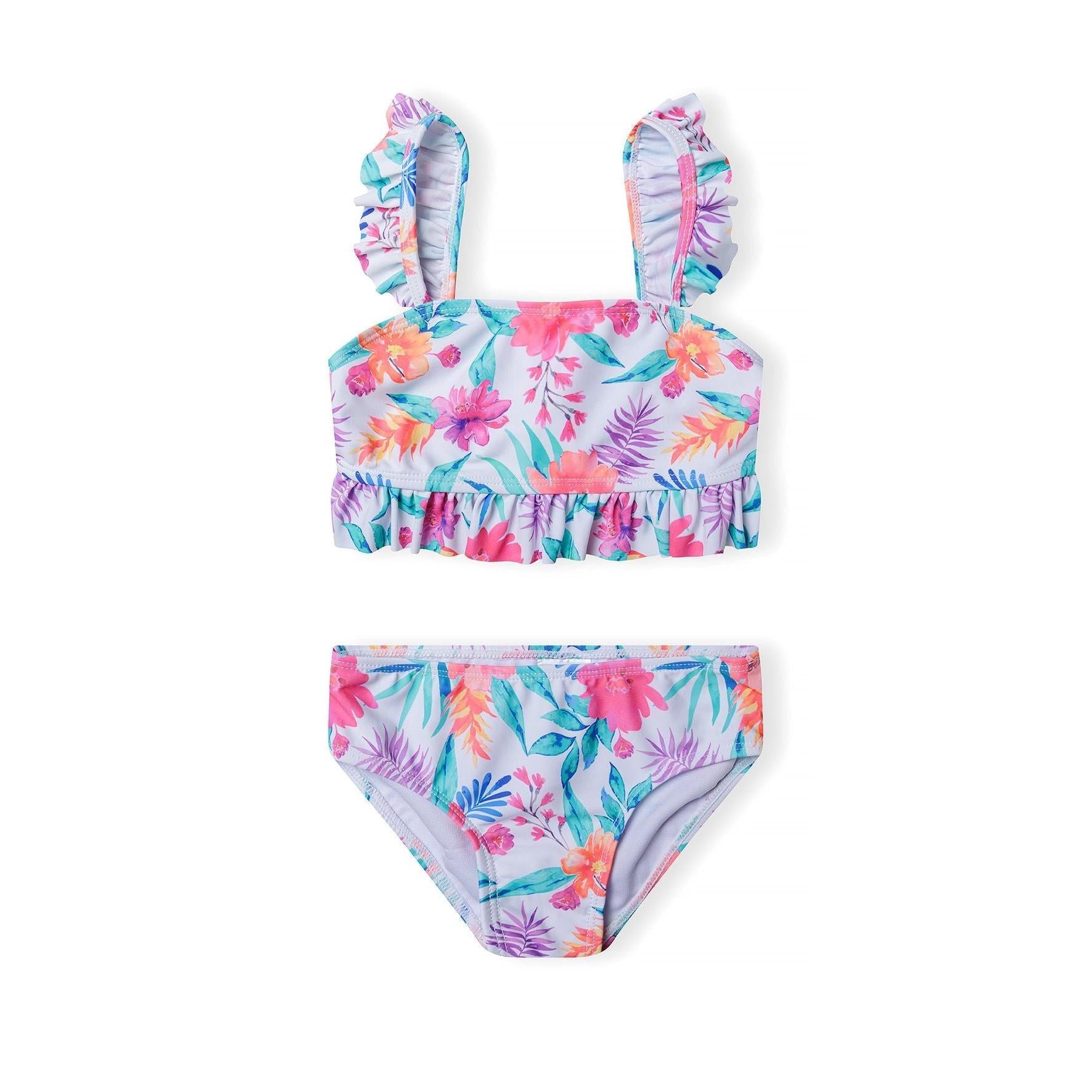 Tropical floral bikini set with ruffled straps on white background showing bandeau top and matching bottoms with hibiscus and palm leaf print