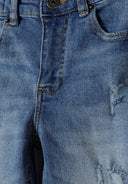 Close-up of navy blue boys denim jeans with ripped design and detailed stitching on pockets and waist area