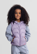 Young girl wearing a lilac sleeveless hooded gilet with zip pockets, showcasing a stylish and cozy design.