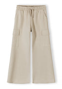 Beige wide leg joggers for girls with cargo pockets and elasticated waist, designed for comfort and style.