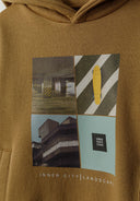 Boys beige hoodie with photographic print, close-up view of front design and pocket.