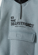 Detail of boys half zip hoodie in blue with printed logo and front pocket.