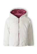 Girls padded reversible jacket in white plush with pink lining, front view, featuring a hood and zip closure.