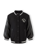 Boys baseball jacket in black, front view with button fastening and ribbed cuffs.