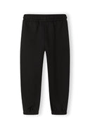 Girls black tracksuit pants, front view, featuring elastic waistband and ribbed cuffs.