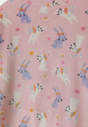 Detail of girls' pink velour pyjama top with bunny print.