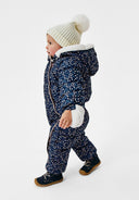 Unisex baby snowsuit in navy with floral print, full zip closure, and attached mitts, side view.