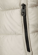 Detail of boys jacket with central zip and quilted texture.