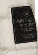 Detail of a patch badge on a grey boys jacket.