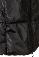 Detail of a black quilted winter jacket with a zipper and padded sections.