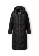 Long black quilted winter jacket with drawstring hood and contrasting zipper, front view.