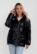 Women quilted black hooded jacket with zip and flap pockets, front view.