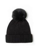 Close-up of a black knitted beanie hat with a faux fur pom pom and ribbed design.