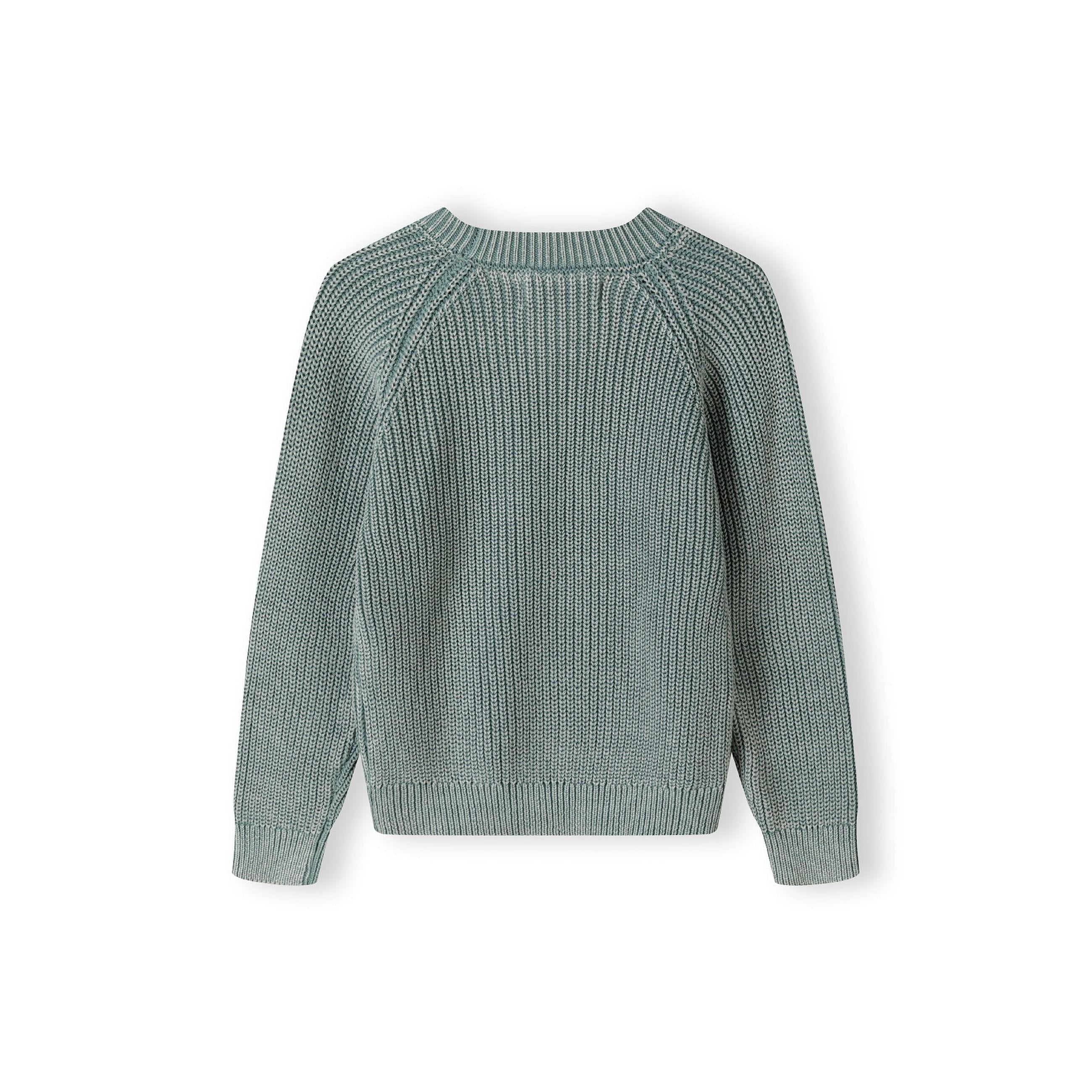 Flat lay of khaki knit jumper showing raglan sleeve construction and ribbed crew neckline on white background
