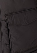 Close-up of a grey men's long jacket with a flap pocket and quilted detail.