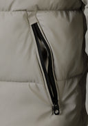 Detail of a men's grey PU jacket showing a side zip pocket.