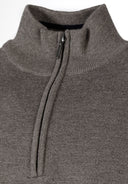 Close-up of a grey men's half zip jumper with ribbed cuffs and a stand collar.