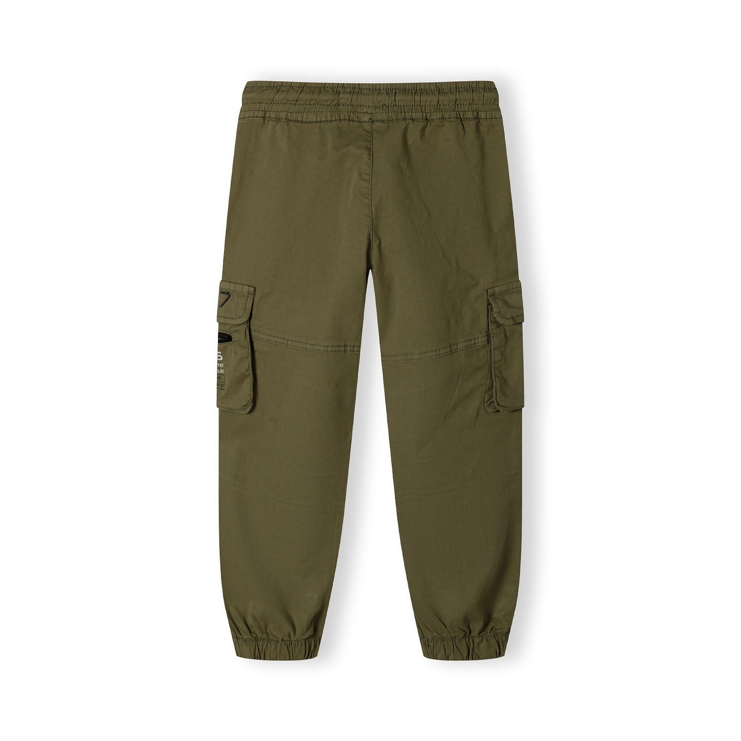 Flat lay of olive green cargo trousers showing full silhouette with cargo pockets and elasticated waistband on white background