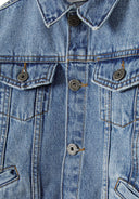 Close-up of a boys denim jacket in navy with button fastening and flap pockets.