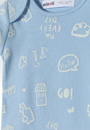 Detail of light blue short sleeve bodysuit with playful prints and envelope shoulders.