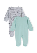 Two long-sleeved boys' sleepsuits, one grey with dinosaur print, one mint green, back view.