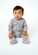 Boys long-sleeved sleepsuit in grey with dinosaur print, front view.