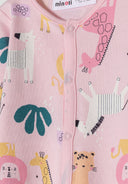 Detail of a girls' long-sleeve sleepsuit in pink with animal prints and front press-stud fastening.