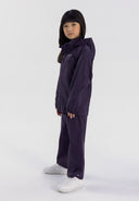 Boys and girls packaway waterproof overpants purple 5-14y worn by a child, made from waterproof fabric, featuring a comfortable fit.