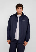 Men's navy packaway waterproof jacket, front view, featuring zip pockets and a hood.