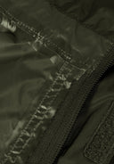 Detail of a khaki waterproof jacket showing zipper and seam details.
