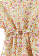 Detail of a girls' short sleeve dress with floral print and cut-outs at the waist.