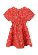 Girls short sleeve red dress with ruffled sleeves and waist cut-outs, back view.