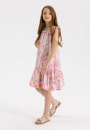 Girls tiered pink dress with wide shoulder straps and ruffled trim, front view.