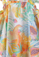 Detail of a girls' tiered dress with colorful fruit print and ruffled shoulder straps.