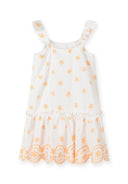 Girls dress with embroidered shoulder straps, white with orange flowers, front view.