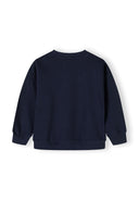 Back view of a girls navy fleece crew neck sweatshirt with ribbed cuffs.