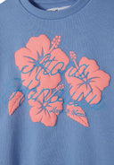 Detail of blue girls fleece sweatshirt with pink floral print and text.