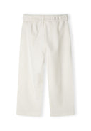 Detail of wide leg joggers with elasticated waistband in cream.