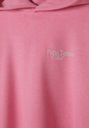 Detail of a pink hoodie featuring 'Paris Tennis Club' print.