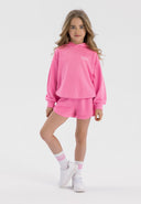 Girls pink hoodie and shorts set, front view, features ribbed cuffs and two pockets.
