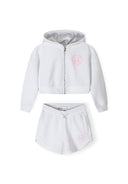 Girls zip-through hoodie and shorts set in white, featuring a printed design on the hoodie.
